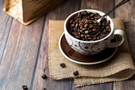 Cup full of coffee beans.の写真素材