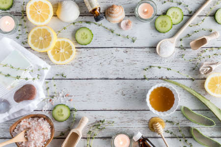 A top down view of various natural remedies in a border arrangement, used for beauty and wellness therapy treatments.の写真素材