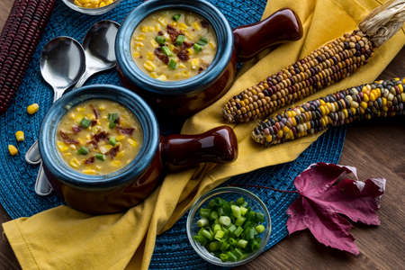 Corn chowder in soup crocks ready for eating.の写真素材