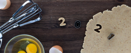 Top down view of a scene making cookies using 2021 cookie cutters. 2021 concept.の写真素材