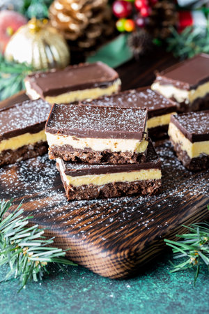 Delicious Nanaimo bars dusted with powdered sugar, ready for eating.