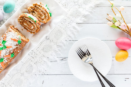 Top down view of a carrot cake jelly roll ready for serving for Easter brunch.