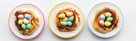 A row of homemade toasted meringue nests filled with mini chocolate Easter eggs.