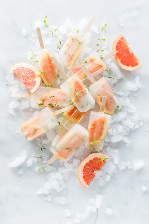 Top down view of grapefruit thyme ice cream  on a bed of ice.