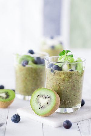 Healthy Kiwi chia pudding parfaits, ready for eating.の写真素材