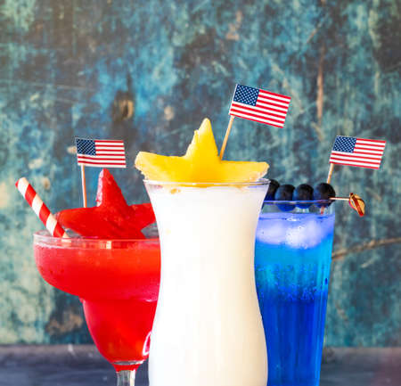 Close up of red, white and blue cocktails for a fourth of July celebration.の写真素材