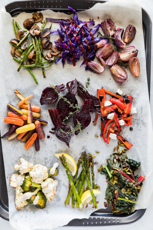 Various roasted and steamed vegetables with assorted toppings.