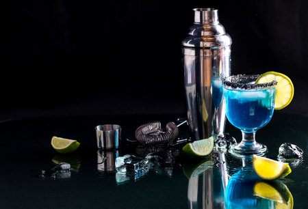 A blue margarita garnished with Hawaiian black salt and lime.の写真素材