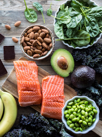 Top down close up view of several healthy raw whole foods.