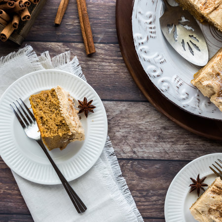A slice of pumpkin spice latte cake with espresso frosting, ready for eating.の写真素材