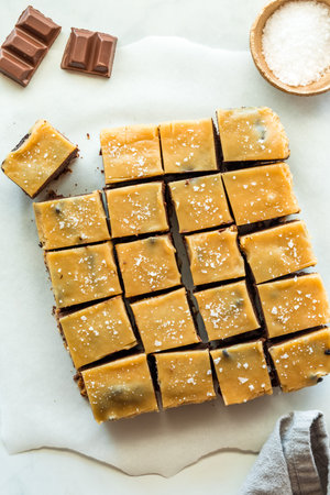 Above view of sweet and salty caramel topped brownie squares.