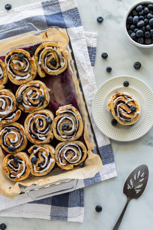 Above view of blueberry cinnamon rolls with icing drizzled on top.の写真素材