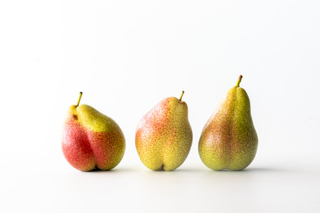 Fresh organic Forelle pears isolated against a white background.の写真素材