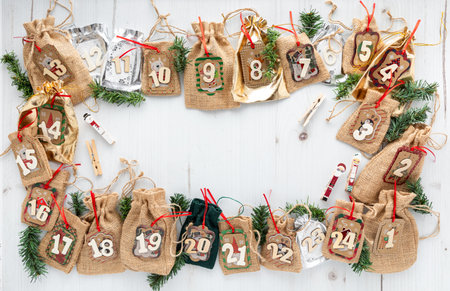 Top down view of a DIY advent calendar with pouches for days 1 through 24.の写真素材