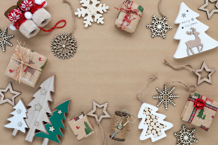 top down view of various holiday season ornaments on brown paper.の写真素材