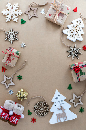 An assortment of wooden decorations on a brown paper background.の写真素材