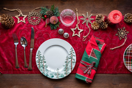 Above view of a festive holiday table runner with various dishes and decorationsの写真素材