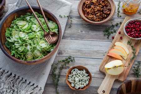 Raw shredded Brussels Sprouts with other fresh ingredients to make a salad.の写真素材