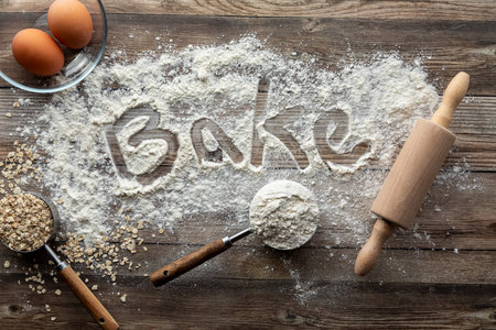 A baking concept background with flour, oats and eggs.の写真素材