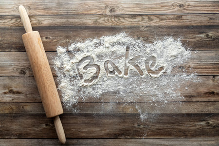 A baking concept background image with flour and a rolling pin.の写真素材