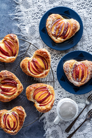 Homemade heart shaped peach filled pastries, ready for eating.の写真素材