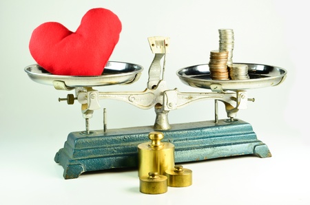 Heart Balance With Money On Backgroundの写真素材