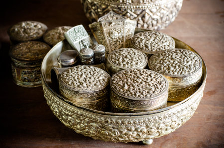 Ancient silverware on wood tableの写真素材