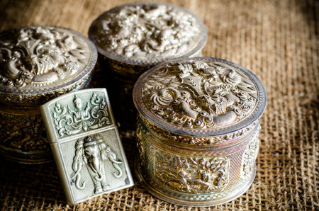 Ancient silverware on brown sackの写真素材