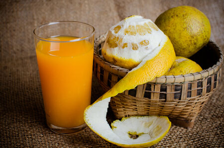Fresh oranges with a glass of orange juiceの写真素材
