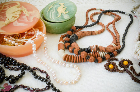 Set of necklace on white fabric の写真素材