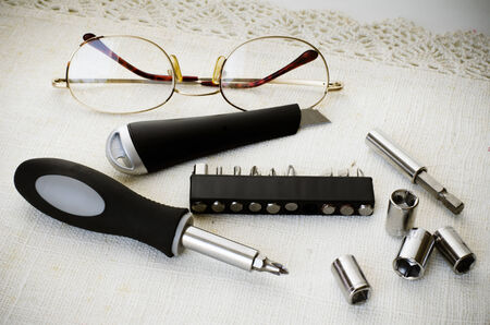 set of DIY tools screw driver cutter wrenches and eyeglassesの写真素材