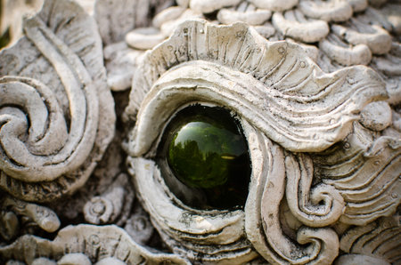 Thai art dragon's eye in Thai templeの写真素材