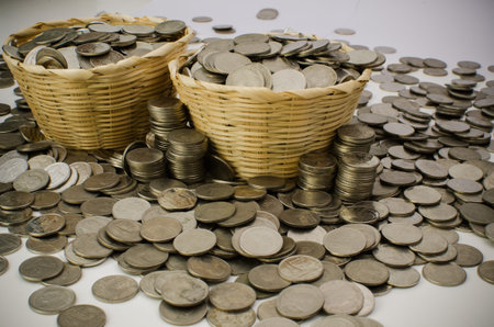 Stack of Thai baht coins stock photo in bamboo bucketの写真素材