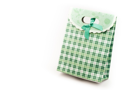 Green pattern paper bag on white backgroundの写真素材