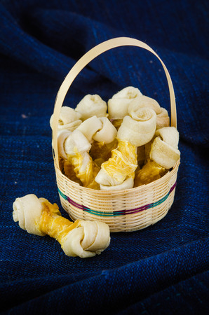 Artificial bone for dog on blue fabricの写真素材