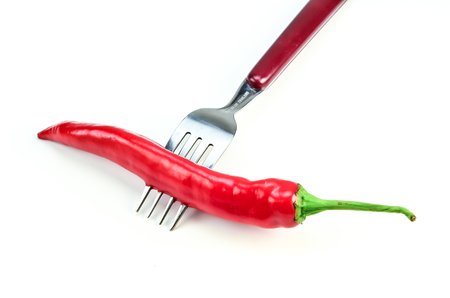 Red Chili with fork on white backgroundの写真素材