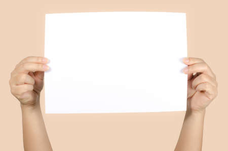 Image of woman's hand holding white paperの写真素材