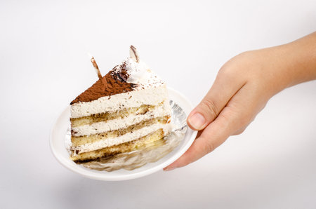 cake in White dish in handの写真素材