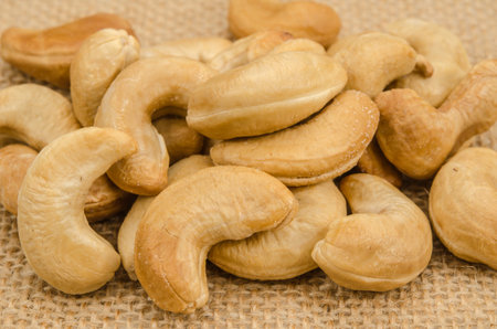Image of cashew nuts on brown sack clothの写真素材