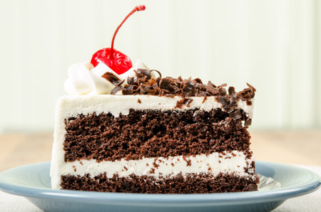 Image of chocolate cake in ceramic dish on   fabric