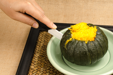 Thai's food, Egg custard in pumpkin in green ceramic dishの写真素材