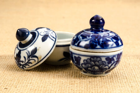 Image of ancient ceramic bowl on brown sack backgroundの写真素材