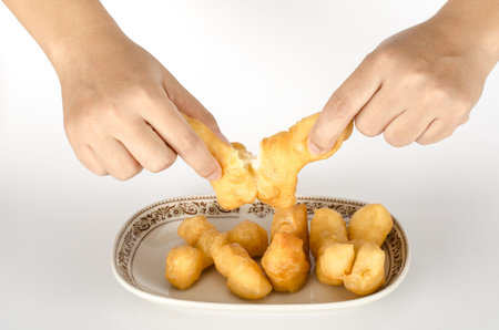 Image of Thai fried dough stick in ceramic dish