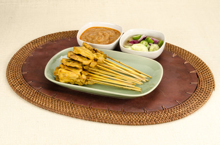 Grilled Pork Satay with Peanut Sauce and Vegetable in Vinegarの写真素材