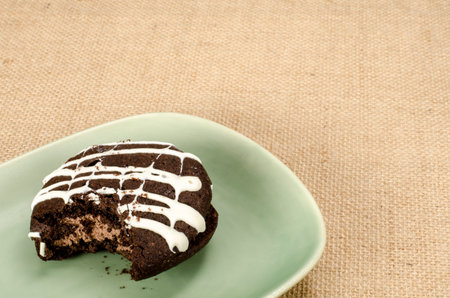 Image of chocolate cookie cake with a bite taken out