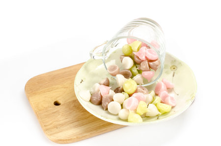 Image of Thai dessert in glass cup on wood cutting board on white backgroundの写真素材