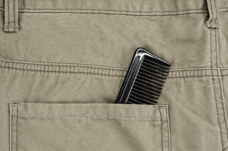Black Hair comb in back pocket pantsの写真素材