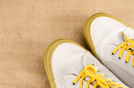 image of canvas shoes on brown sack backgroundの写真素材
