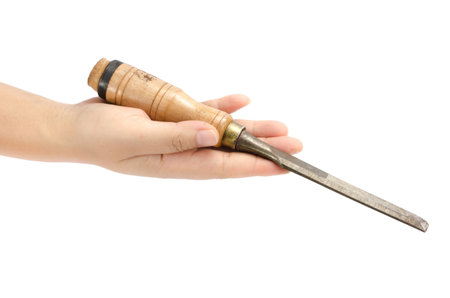 Image of carpenter chisel holding by hand