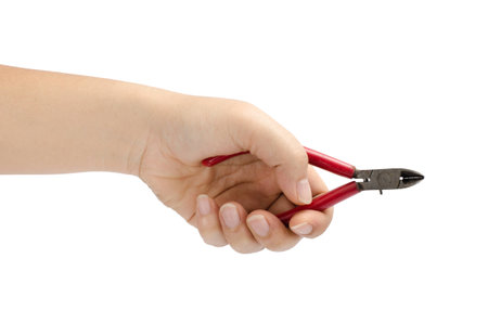Image of hand holding cutting pliers isolate on white backgroundの写真素材